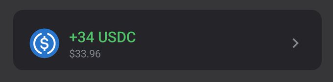 A dark notification card displays a USDC cryptocurrency receipt showing "+34 USDC" received, valued at "$33.96."