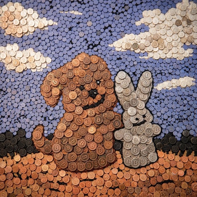 Mosaic artwork depicting a mother holding a child, composed entirely of physical Bitcoin coins in copper and silver tones.