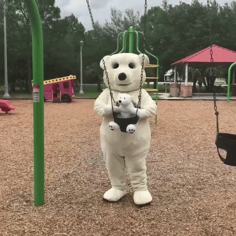 The image features a white teddy bear dressed up as a polar bear swinging from a swing set at a playground, with a green pole nearby. The caption of the image reads "Happy Father's Day! To the first builders, first believers, and first teachers in our lives. Wishing all the amazing dads a wonderful day onchain and beyond." This post seems to be related to Father's Day celebrations or an event honoring those who have made significant contributions to society.