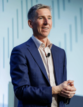 Bitwise CIO Matt Hougan speaks at a conference. The image accompanies a post about his prediction that Bitcoin could reach $1.3 million by 2035, driven by institutional capital inflows.