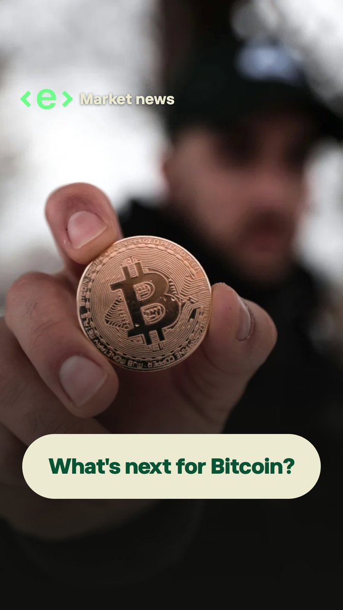 A person holds up a physical Bitcoin token in front of a blurred outdoor background, with text overlays reading "Market news" and "What's next for Bitcoin?" tying the visual to a crypto discussion.