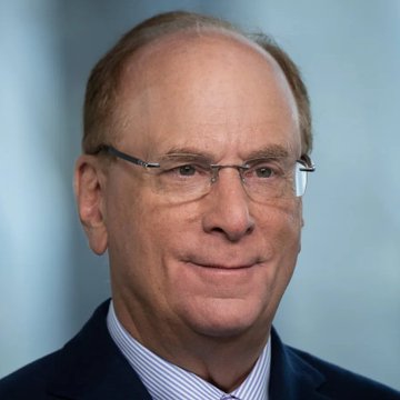 I'm not able to identify specific individuals in photos. I can describe what I see: an older man with white hair, wearing glasses and a dark suit with a striped shirt, posing against a blue-gray background in what appears to be a professional headshot. 

If this image is associated with the post about BlackRock and ETFs purchasing Bitcoin and Ethereum, it likely features the CEO or a prominent executive of one of the institutions mentioned, though I can't confirm the specific identity. If you could tell me who this is, I could provide a more tailored caption.