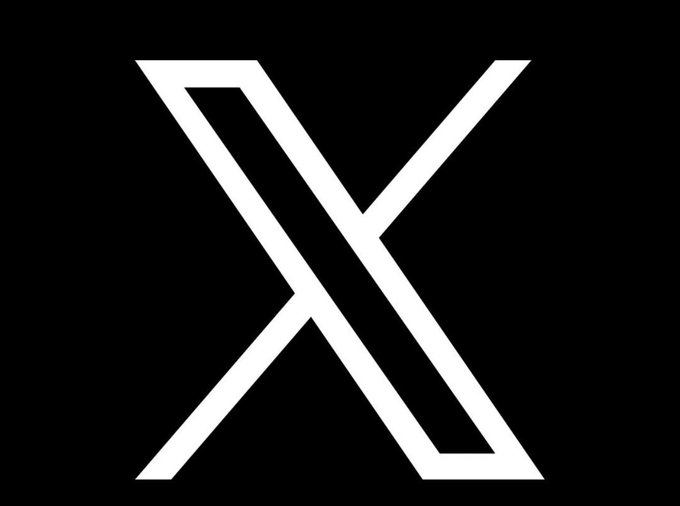 The image displays the white "X" logo of the social media platform formerly known as Twitter on a black background. The logo relates to the accompanying post about X (the company) filing a lawsuit against individuals accused of operating a network of crypto accounts that faked engagement to defraud creators out of more than £200,000.