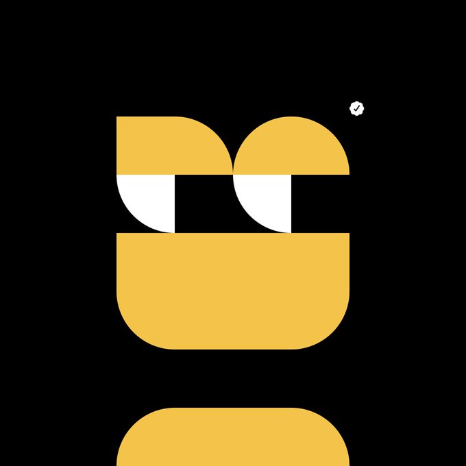 A minimalist logo design featuring two abstract yellow and white face-like shapes stacked vertically on a black background, with a small verified checkmark icon in the upper right.