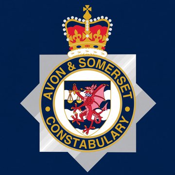 The image displays the Avon & Somerset Constabulary badge, featuring a red dragon and a crown emblem, against a dark blue background. This official insignia represents the UK police force referenced in the post, which seized £1.03 million ($1.36M) in crypto and cash, including 20.21 BTC, from a criminal asset case linked to darknet marketplaces.