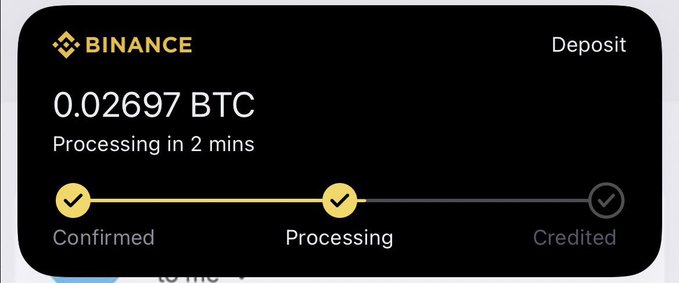 The image shows a screenshot of a Bitcoin trading app called Binance, displaying a process that says "0.02 $BTC processing in 2 minutes", indicating that someone may be spending money on bitcoin this Sunday. Additionally, the post suggests that people should write their Binance usernames and claim 5 lucky individuals as rewards for participating in this event.