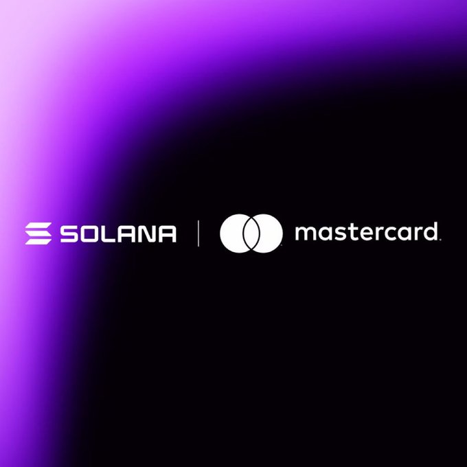 The image features a purple background with white text that reads "Mastercard" and "@Mastercard is bringing always-on stablecoin settlement to Solana". The text is positioned above an oval logo, which is a circle split into two parts - one part is white and the other is black. The white part of the logo has a line through it, while the black part remains intact. This design creates a visually striking contrast between the two halves of the logo.