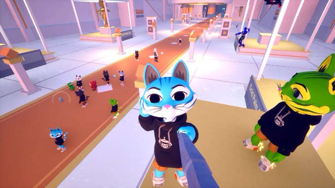 A screenshot from a 3D video game or virtual world showing anthropomorphic cat and frog characters wearing black hoodies standing in a pink and orange futuristic plaza.