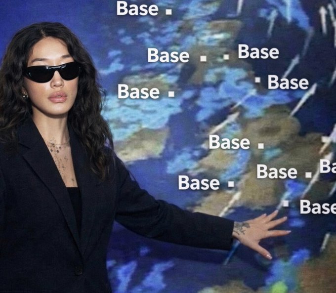 A woman wearing sunglasses and a black blazer stands in front of a map-patterned background, with the word "Base" repeated multiple times overlaid on the image.