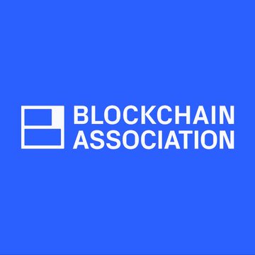 The Blockchain Association logo appears on a bright blue background, featuring white text and a stylized square icon. The logo represents the organization referenced in the post, which is advocating for clearer compliance limits and the use of digital identity tools under the GENIUS Act.
