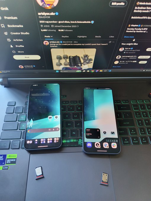 Two Solana Mobile Seeker smartphones rest on a laptop keyboard displaying Twitter/X, with the user's profile "artdfor.skr" showing 9,443 Following and 10.5K Followers, while two SIM cards (one physical, one eSIM tray) sit in front to illustrate the post about easily swapping SIM cards between devices.