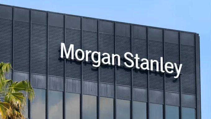 The image shows the exterior of a Morgan Stanley office building with the company's name displayed prominently in white lettering on a dark gray facade. The building's signage connects to the news of Morgan Stanley filing for spot Ethereum and Solana ETFs, highlighting the financial institution behind these new investment products.