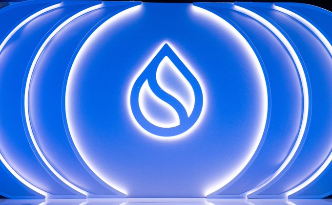 A glowing blue Sui cryptocurrency logo displayed on a series of illuminated circular panels.