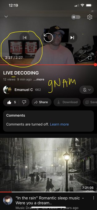 The image shows a YouTube video titled "LIVE DECODING" by Emanuel C with 662 views, 12 views currently, uploaded 9 minutes ago, playing at timestamp 2:27/2:27, with "gNAM" handwritten in yellow. Below it, a recommended video titled "In the rain" Romantic sleep music appears, with the post referencing Babacugs' live decode on July 16, 2023, suggesting a transition between games/eras for XRP on Leo's date.