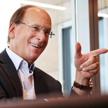 A smiling older man in a suit and glasses gestures with his hand in what appears to be a modern office setting. The post suggests this may be a financial executive, likely referencing BlackRock's CEO Larry Fink, whose firm is making a substantial $42.46M Ethereum purchase while retail investors remain cautious about the crypto market.