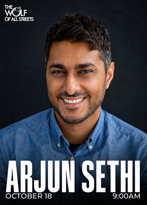 A promotional poster for "The Wolf of All Streets" featuring a smiling man in a blue button-down shirt, with text announcing "ARJUN SETHI" speaking on October 18 at 9:00 AM. The image ties to the post highlighting Arjun Sethi's talk on how Bitcoin transformed money and what future innovations might be on the horizon.