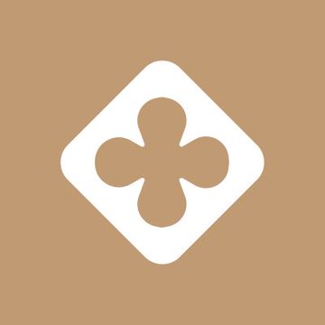 A white playing card suit symbol (clubs) inside a white rounded diamond shape on a tan/brown background. The image relates to the post by showing a project logo without the typical green background, matching the user's point that notable Robinhood Crypto projects can stand out without that signature green coloring.