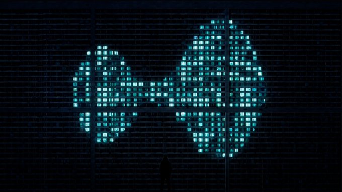 A lone figure stands silhouetted before a massive, pixelated cyan display where the word "HYPE" glows in bright digital letters, visually amplifying the post's declaration that "gm the $HYPE is real."