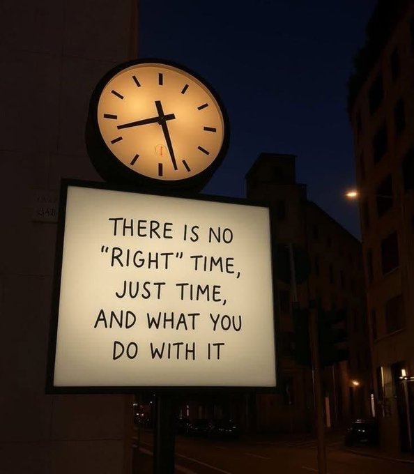 The image features a clock mounted on a pole with a sign underneath that reads "There is no 'right' time, just time, and what you do with it." The clock has black hands and numbers, while the sign below it contains text in white letters. The background of the image shows an urban setting with buildings visible behind the clock and sign.
