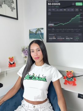 A woman in a white 'BIG GAME' crop top sits in a room with stock trading screens displaying $SO at $0.03026 in the background, with small figurines visible on her desk.
