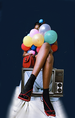 A stylized fashion photo of a woman with dark skin holding colorful balloons (pink, yellow, orange, blue) while wearing black socks with red bows and black shorts with a red handbag, sitting on an old television against a dark blue background.