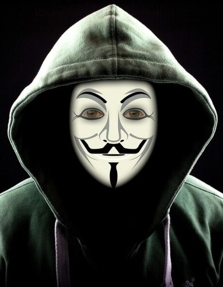 A figure in a Guy Fawkes mask and green hood, symbolizing anonymous hackers, stares out from a dark background. The image represents the faceless cybercriminals who targeted the Bitget exchange on its 8th birthday during the Mid-Autumn Festival.