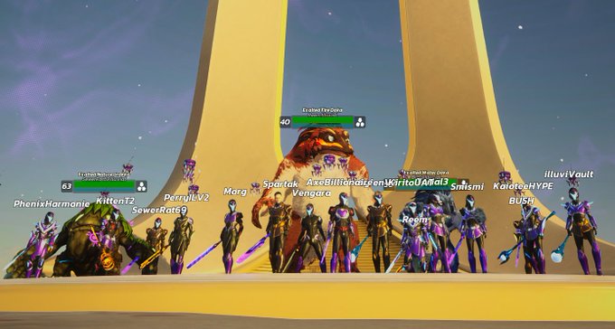 A group of players, including usernames like "PhoenixHarmonic," "KittenF2," "Spar-ak," "Moray," "Vengara," "Regis," "mirismi," and "illuvivault" (with player "Kitten Malucore" at level 63 and "Ecahed Fireforge" at level 40), pose together in front of a giant glowing obelisk structure with a large bear mount, capturing a celebratory moment marking the end of the Obelisk Rising pre-alpha playtest.