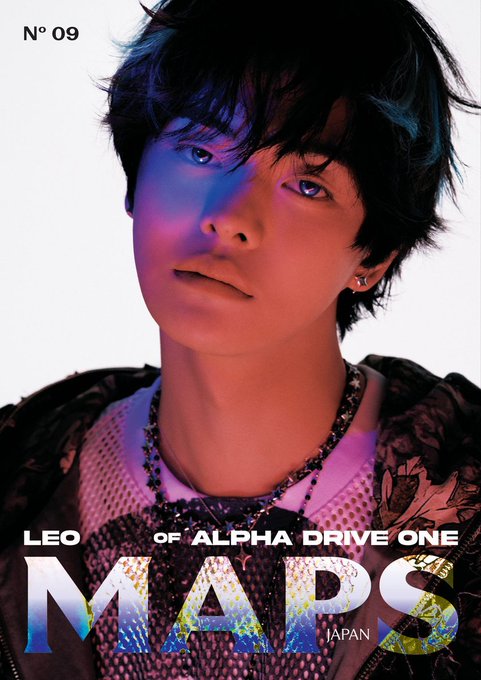 The image features a young man with short hair wearing a pink shirt, looking directly at the camera. The background of the photo is white, which contrasts with the colorful elements in the foreground. There are two words written above him that read "leo for maps japan #LEO #리오 판단". This suggests that the image might be related to a social media post or an advertisement featuring Leo and his journey through various locations using maps as a guide.
