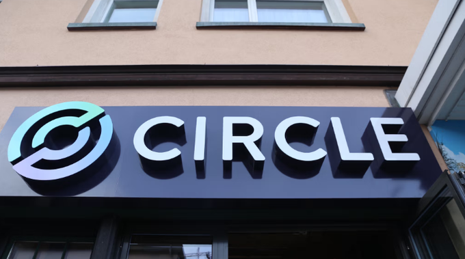 A storefront sign displays the "CIRCLE" logo and name in white lettering against a dark background, identifying the office of Circle—the issuer of USDC stablecoin ($CRCL)—which has just been officially granted a Trust Charter by the New York State Department of Financial Services (NYDFS).