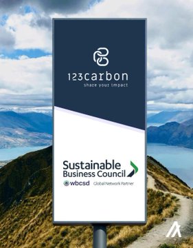 A billboard for '123carbon - share your impact' promoting a Sustainable Business Council as a WBCSD Global Network Partner, set against a mountain landscape.