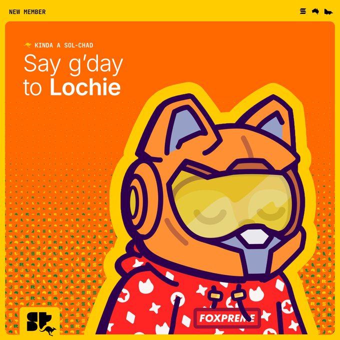 The image features a cartoon cat wearing an orange helmet with goggles and a red jacket. The cat appears to be wearing a headset that has "Say G'Day to Lochie" written on it, suggesting a connection between the cat's outfit and the theme of the post. The background is a gradient of orange and yellow colors, which complements the overall design of the image.