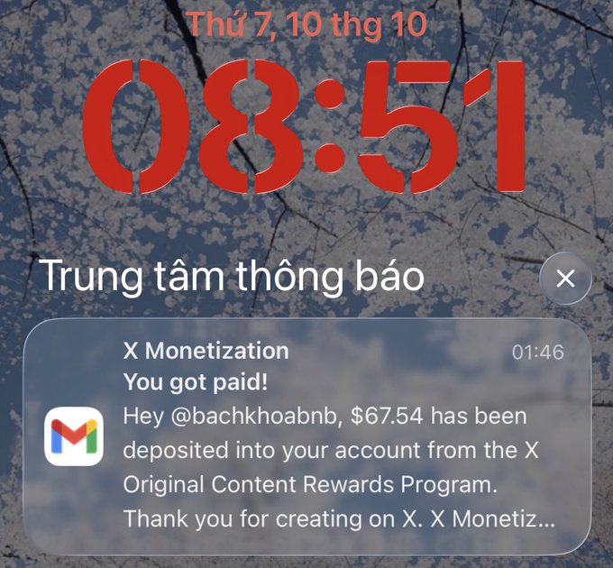 A smartphone lock screen notification from X Monetization stating 'You got paid!', notifying user @bachkhoabnb of a $67.54 deposit.