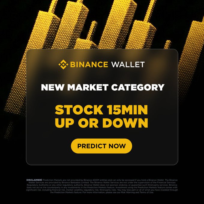 A Binance Wallet promotional graphic announcing a new "Stock 15Min Up or Down" prediction market category with a "PREDICT NOW" call-to-action button, set against a black and gold cityscape background with city skyline imagery. The image visually reinforces the post's announcement of Binance's partnership with @predictdotfun to launch a 15-minute stock price prediction market for major tech and AI stocks.
