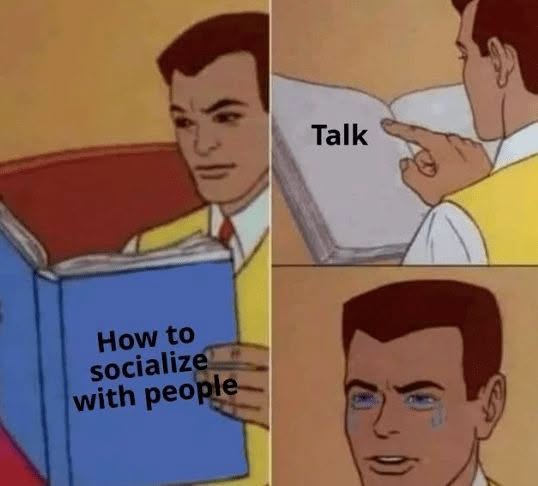 A cartoon man reads a book titled "How to socialize with people," only to see the word "Talk" on the page and immediately burst into tears. The meme humorously relates to the post "GM fellow introverts" by capturing the exhausted, tearful dread introverts feel at the simple idea of socializing through conversation.