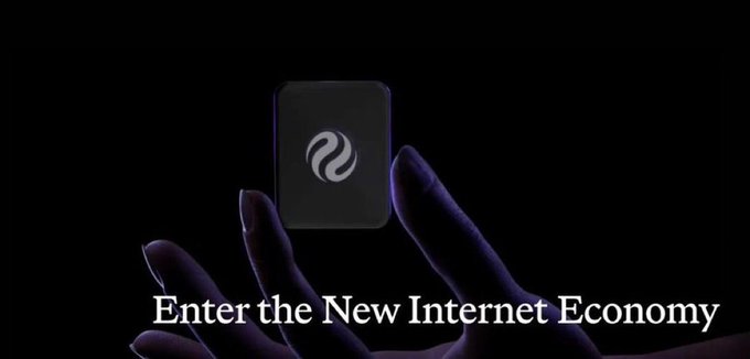 A hand reaches up from darkness toward a glowing dark cube bearing Injective's swirl logo, with the caption "Enter the New Internet Economy" displayed below. The imagery aligns with the post's theme, symbolizing Injective's emergence as a MultiVM blockchain bridging DeFi and the broader internet economy rather than just another Layer-1 chain.