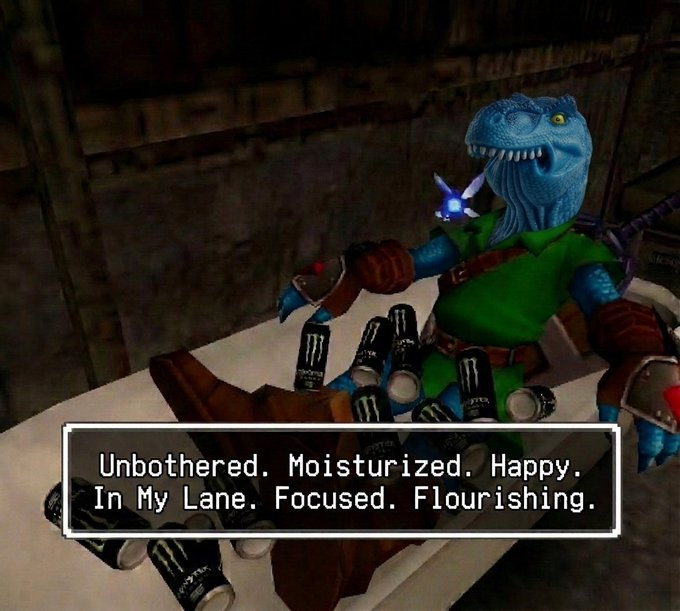 A video game character resembling a blue reptilian warrior sits on a couch surrounded by Monster Energy drink cans with a caption reading 'Unbothered. Moisturized. Happy. In My Lane. Focused. Flourishing.'