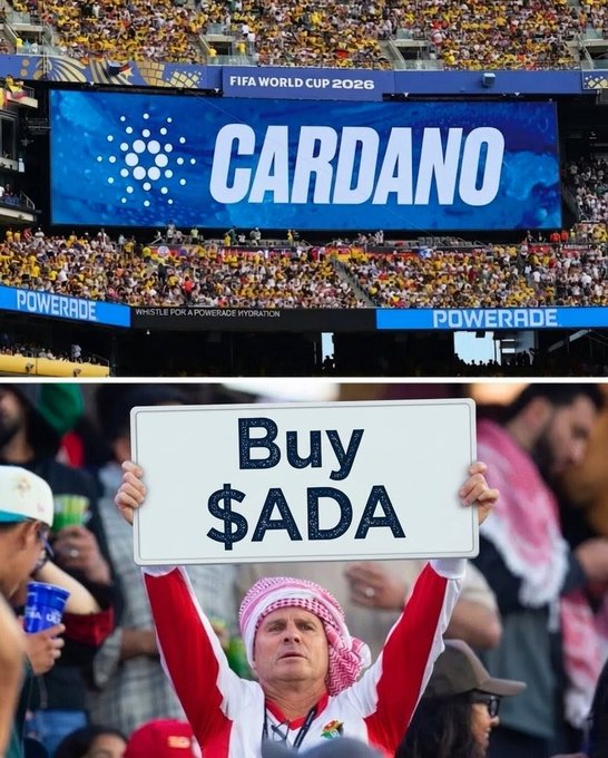 A stadium display advertises Cardano at the FIFA World Cup 2026, with a fan below holding a "Buy $ADA" sign, celebrating Cardano's sponsorship and encouraging investment in the ADA cryptocurrency.