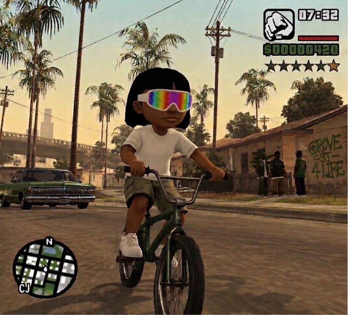 A screenshot from the video game GTA San Andreas showing a young child character wearing oversized rainbow sunglasses riding a bicycle through a palm-tree lined street, with a HUD displaying $00000420, the time 07:32, and a mini-map.