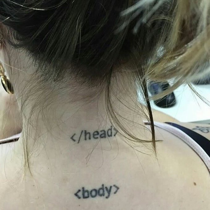 A close-up image showing the back of a person's neck and hair, featuring two small HTML code tattoos: "</head>" near the hairline and "<body>" on the upper back, referencing programming terminology.