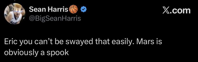 The image shows a tweet from verified user Sean Harris (@BigSeanHarris) that reads: "Eric you can't be swayed that easily. Mars is obviously a spook." The tweet humorously dismisses Mars as a "spook" (a myth or fake), which complements the post's playful reference to the "2028 Meme Factory Halving Party" by contributing to a tongue-in-cheek, conspiratorial tone fitting for a meme-related context.