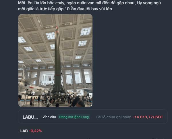 A Vietnamese-language financial news graphic showing a missile on display, with ticker 'LABU...' showing a loss of -14,619.77 USDT and LAB down 0.42%.