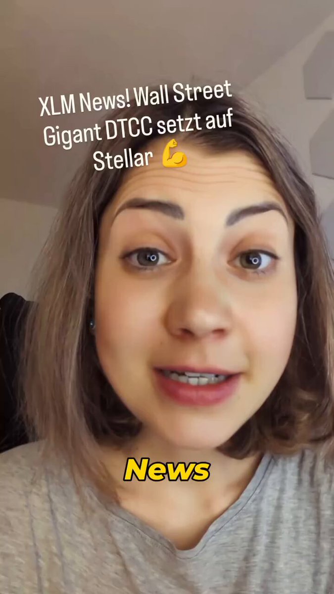 The image features a woman with short brown hair wearing a grey shirt, looking at the camera while smiling. The caption below her photo reads "Wall Street giant DTCC is betting on @StellarOrg XLM. You can find out what this step means here". This suggests that there might be some news or information related to the Wall Street giantDTCC and the organization @StellarOrg, which could be of interest to the viewers.