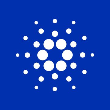 The image displays the Cardano (ADA) logo—a circular arrangement of white dots forming a hexagonal pattern on a blue background—symbolizing the blockchain's network architecture. The logo visually represents the Cardano platform undergoing the Plutus smart contract upgrade with native BLS12-381 signature verification, highlighting the project's continued technical advancement.