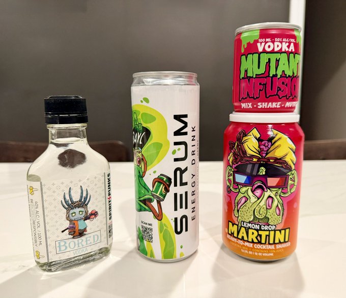 The image shows three beverage products from brands featured in the post: a mini bottle of Bored Vodka (50ml, 100 proof), a can of Serum Energy Drink in "Sour Me" flavor, and a Lemon Drop Martini Mutant Infusion made-to-mix cocktail shaker, representing the "MADE BY APES" brands sponsored at the LA event.