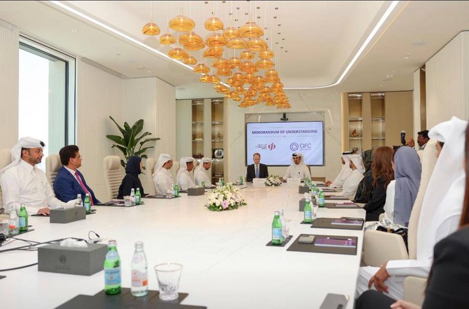 A formal business meeting takes place in a modern conference room with an ornate chandelier, where executives—including several men in traditional white Gulf attire—sit around a long table facing a screen displaying "MEMORANDUM OF UNDERSTANDING" alongside the CFC and Sidra logos. The image appears to depict the official signing of a partnership or MOU, visually supporting the post's claim that "something big is cooking" behind the scenes for #SidraDEX and #SidraChain, hinting at an imminent new chapter for the #SDA / Web3 project.