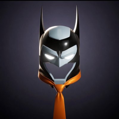 The image features a Batman mask with an orange tie around its neck, giving it a unique and playful appearance. The mask is displayed against a purple background, which further emphasizes its striking design. The caption of the image reads "#NewProfilePic A gift from @TRUMediaGroup #saylor may notice his batcowl is missing!".