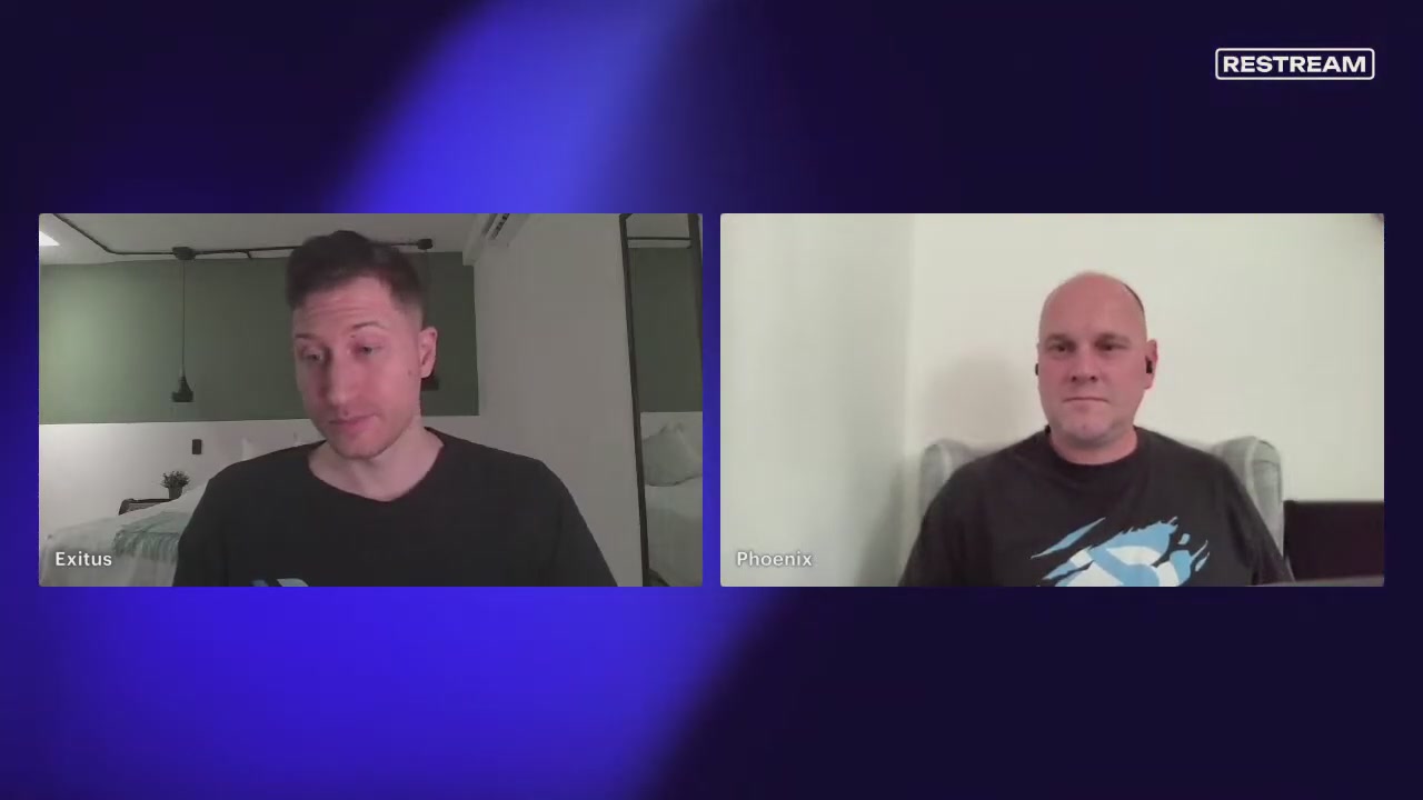 The image shows two men sitting next to each other, both looking at a screen with their faces displayed. The man on the left has his head tilted back while the man on the right looks directly at the camera. They appear to be engaged in an online conversation or discussion. In the background of the image, there is text that reads "#DECRED EP14" and "@DecredSociety". This suggests that they might be discussing a topic related to the Decred community or sharing information about a specific event or project within this community.
