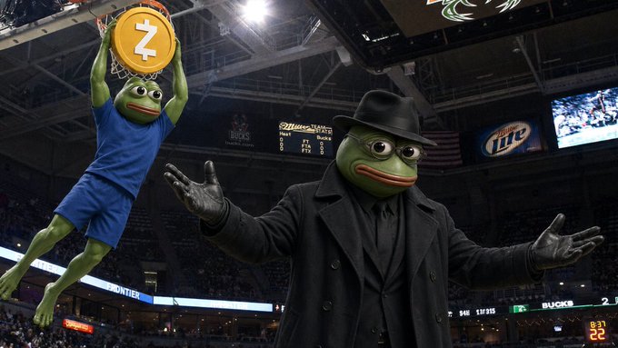 An edited meme image showing two Pepe the Frog characters in a Milwaukee Bucks basketball arena, with one dunking a Zcash (Z) branded basketball.