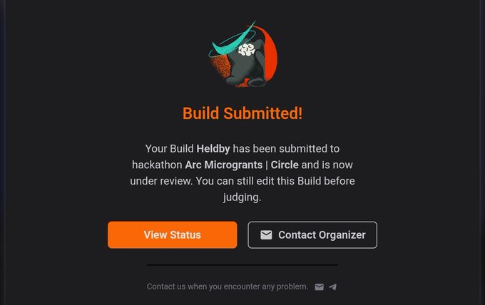 A dark-themed web page displaying 'Build Submitted!' with a confirmation that 'Your Build Heldby has been submitted to hackathon Arc Microgrants | Circle.'