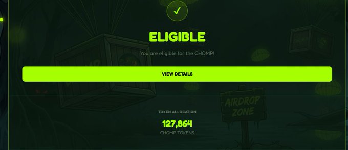 A dark-themed digital interface showing an 'ELIGIBLE' notification for a CHOMPI airdrop with a green checkmark, a 'VIEW DETAILS' button, and a 'TOKEN ALLOCATION' of 127,864 CHOMP TOKENS next to an 'AIRDROP ZONE' sign.